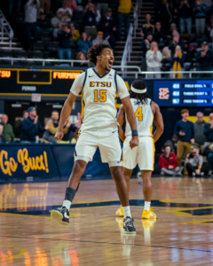Bucs battle it out and overcome Paladins in OT, 75-71