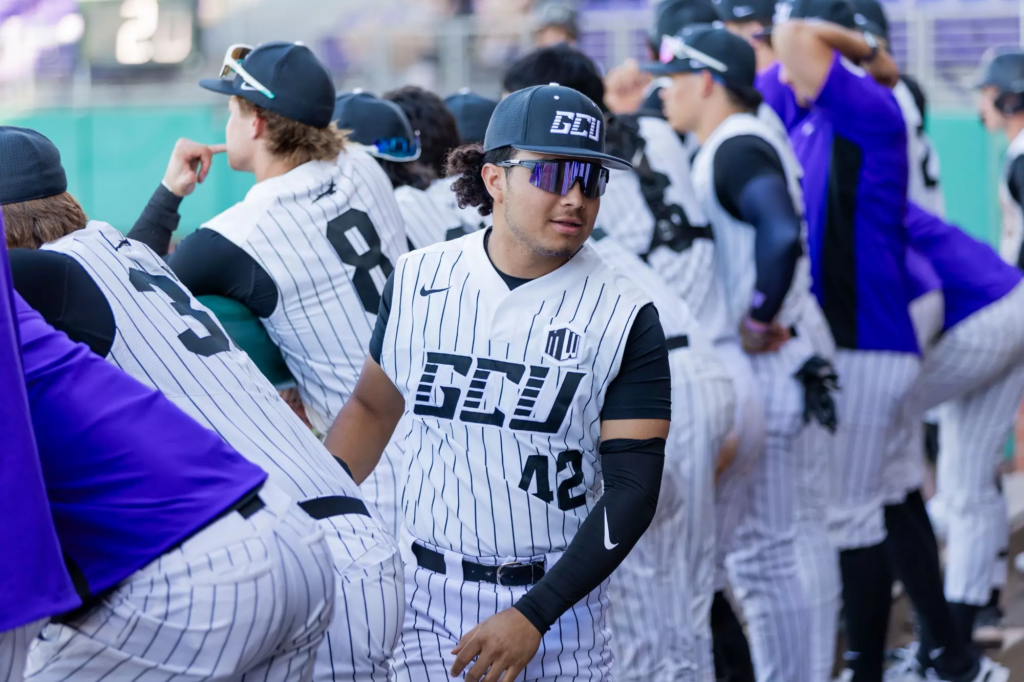 GCU Baseball #42 Troy Sanders in the dugout ahead of game vs Northeastern. 