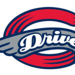 Logo with the word 'Drive' in white script inside a gray wing and a red curved ring behind it.