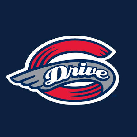 Team logo for 'Drive' featuring a gray wing across a red circular ring on a dark blue background