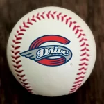 White baseball with red stitching and a blue/red 'Drive' logo at the center.