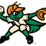 Green insect mascot wearing an orange cap and white uniform, pitching a baseball.