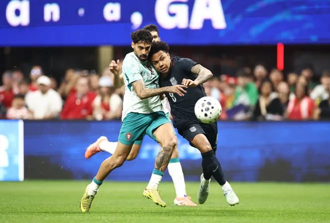 Weston McKennie of United States and Samu Costa of Portugal compete for the ball during the international friendly match between United States and Portugal at Mercedes-Benz Stadium on March 31, 2026 in Atlanta, Ga.