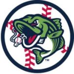 Circular team logo featuring a green bass fish inside a navy ring, with red baseball stitching in the background.