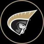 Logo of a Trojan helmet facing right inside a black circle with a gold ring.