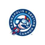 Logo of the Kannapolis Cannon Ballers baseball team, featuring a shark wearing a helmet inside a blue circular badge.