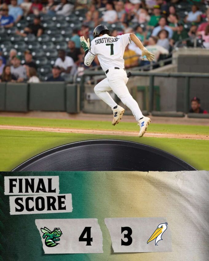 Baseball player in white, mid-air, celebrating near the final score banner reading 4–3.