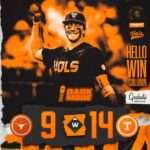 Smiling Tennessee Volunteers player in black uniform lifts a ball to celebrate, orange-dominated collage and 'HELLO WIN COLUMN' text nearby. Final score 9–14 at the bottom.