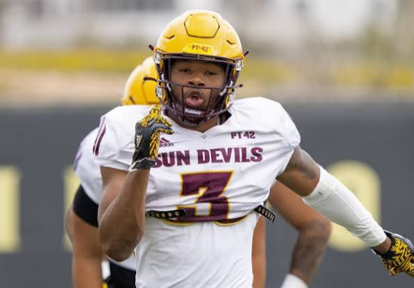 Sun Devils football player, number 3, in a white jersey with yellow helmet, running on the field during a game.