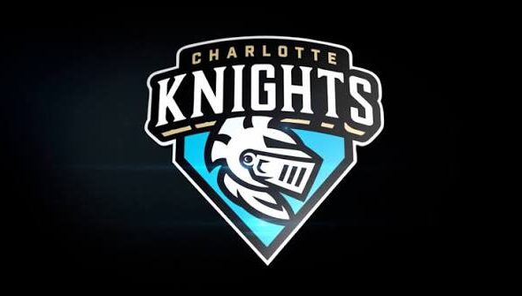 Charlotte Knights team logo featuring a knight's helmet on a blue shield against a dark background.